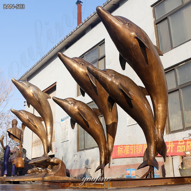 copper dolphin sculptures