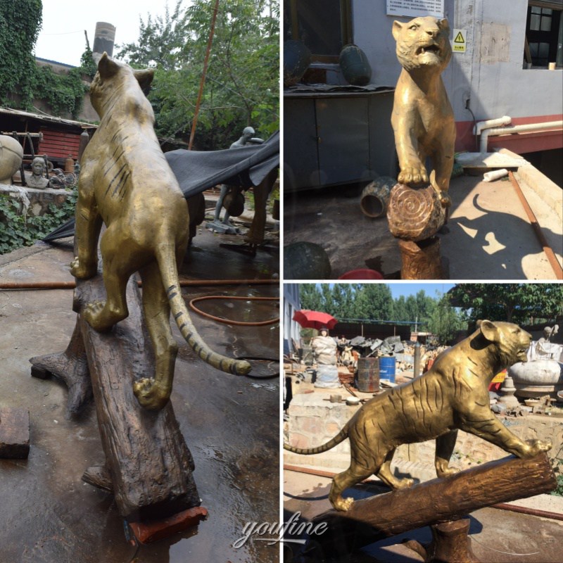 finished tiger standing on trunk sculpture