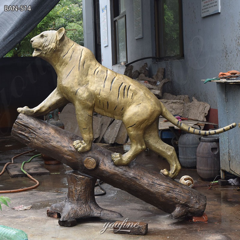tiger standing on a trunk statue