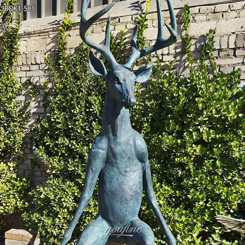 bronze sitting deer statue