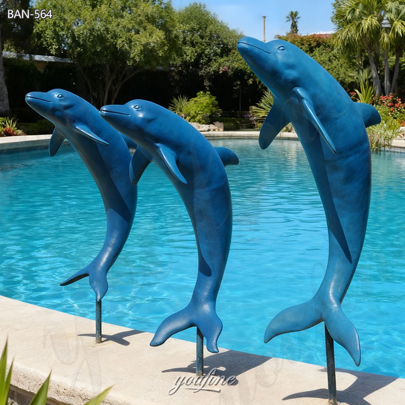 large brass dolphin sculpture