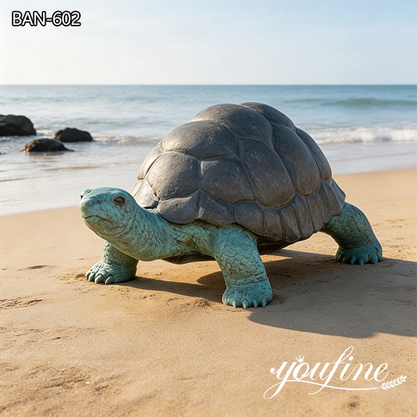 bronze turtle garden statue on beach