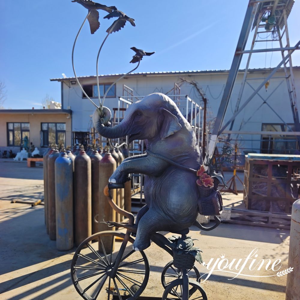 elephant-on-bicycle-bronze-sculpture