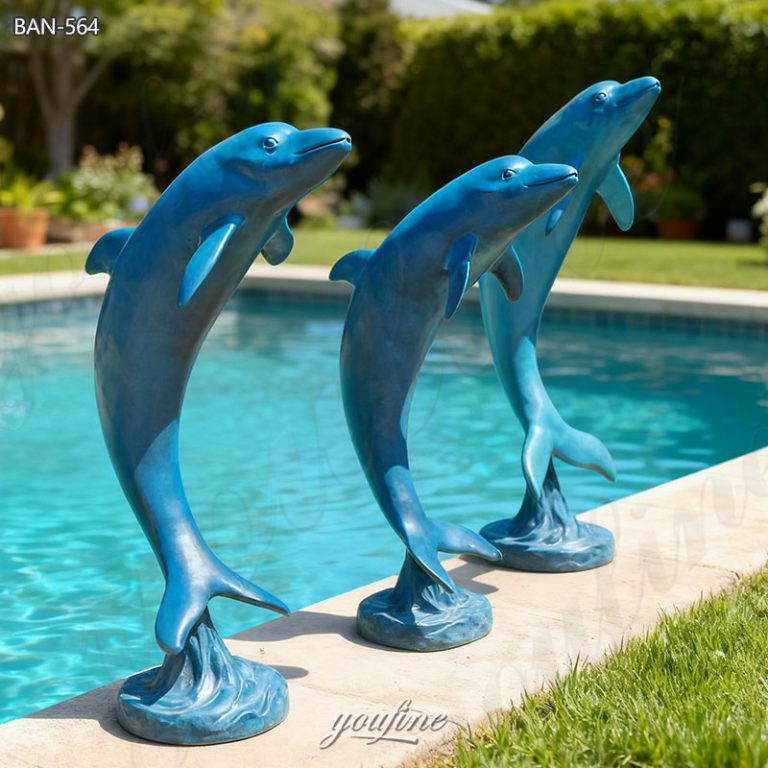 brass dolphin sculptures