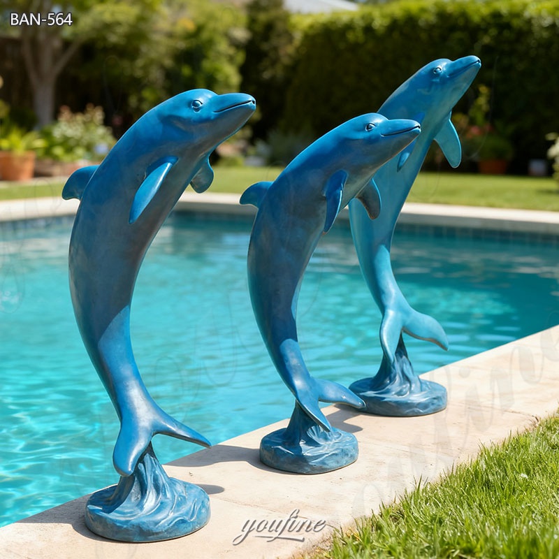 brass dolphin sculptures