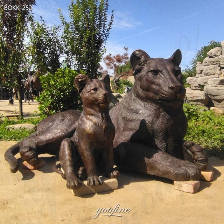 bronze lion and lamb garden statue